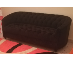Chesterfield (buttoned) style with arms curving Couch
